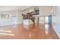 Open living area with hardwood floors and a staircase at 4650 Heather Ct, Union City, GA 30291
