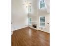 Bright living room featuring hardwood floors and a fireplace at 4060 Willowmere Pointe Nw, Kennesaw, GA 30144