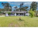 Ranch house with white brick exterior and landscaping at 903 Bingham Ln, Stone Mountain, GA 30083