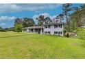 Ranch house with white brick exterior and landscaping at 903 Bingham Ln, Stone Mountain, GA 30083