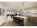 Gourmet kitchen boasts expansive granite island, modern cabinetry, and high-end appliances at 3107 Peachtree Road Ne Unit #1803, Atlanta, GA 30305