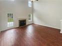 Spacious living room with hardwood floors and fireplace at 340 Lakeview Trl, Covington, GA 30016