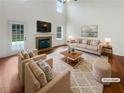 Virtually staged living room with fireplace and hardwood floors at 340 Lakeview Trl, Covington, GA 30016