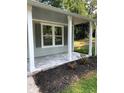 Front porch with new flooring and landscaping at 5364 Cedar Rock Dr, Stonecrest, GA 30038