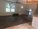 Spacious living room with hardwood floors and stairs at 5364 Cedar Rock Dr, Stonecrest, GA 30038