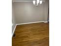 Bright dining room with hardwood floors and chandelier at 3370 Knighton Rdg, Powder Springs, GA 30127