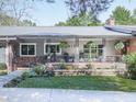 Ranch style home with a covered porch and brick facade at 419 Sunset Dr, Canton, GA 30114