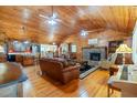 Open living room with hardwood floors and stone fireplace at 2298 Cole Lake Rd, Dallas, GA 30157