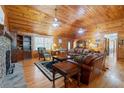 Living room with stone fireplace and hardwood floors at 2298 Cole Lake Rd, Dallas, GA 30157