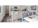 Modern kitchen features granite countertops and stainless steel appliances at 2489 Argento Cir, Dacula, GA 30019