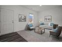 Living room with light walls, hardwood floors, and modern furniture at 2489 Argento Cir, Dacula, GA 30019