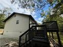Back deck with stairs leading to the backyard at 8165 Thompson St, Douglasville, GA 30134