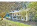 Brick ranch home with covered porch and landscaping at 4660 Edwina Sw Ln, Atlanta, GA 30331