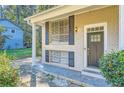 Brick ranch home with dark door and landscaping at 4660 Edwina Sw Ln, Atlanta, GA 30331