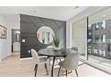Elegant dining room with a round table and geometric wall at 371 Grant Se Cir # 1814, Atlanta, GA 30315