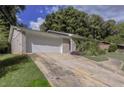 Brick home with a long driveway and a landscaped yard at 2895 Springfield Ct, Atlanta, GA 30349