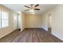 Bright living room features hardwood floors and ceiling fan at 541 N Hairston Rd, Stone Mountain, GA 30083