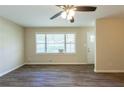 Living room with hardwood floors and large windows at 541 N Hairston Rd, Stone Mountain, GA 30083