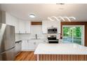 Updated kitchen featuring stainless steel appliances and a breakfast bar at 3900 Hilton Cts, Decatur, GA 30035