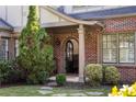 Charming front entrance with brick facade and arched doorway at 1273 Oakdale Ne Rd, Atlanta, GA 30307