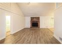 Spacious living room with brick fireplace and laminate flooring at 4111 Wrexham Dr, Snellville, GA 30039