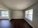 Spacious living room with dark hardwood floors and a fireplace at 3996 Kenner Sw Dr, Atlanta, GA 30331