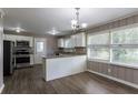 Updated kitchen with stainless steel appliances and granite countertops at 2362 Manor Ave, Atlanta, GA 30344