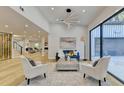 Bright living room with hardwood floors, modern furniture, and large windows at 5255 Buice Rd, Alpharetta, GA 30022