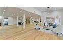 Open concept living area with hardwood floors and recessed lighting at 5255 Buice Rd, Alpharetta, GA 30022