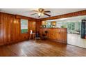 Wood-paneled dining room with hardwood floors at 3024 Bob Cox Rd, Marietta, GA 30064