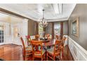 Elegant dining room with hardwood floors, large round table, and chandelier at 713 Bronze Ct, Acworth, GA 30102