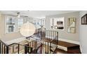 Loft overlooking living room with open railing and hardwood floors at 1078 Piedmont Ne Ave # 106, Atlanta, GA 30309