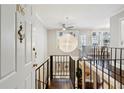 Two-story entryway with hardwood floors, a loft, and open staircase at 1078 Piedmont Ne Ave # 106, Atlanta, GA 30309