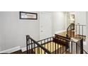 Entryway with hardwood floors, an open staircase, and neutral walls at 1078 Piedmont Ne Ave # 106, Atlanta, GA 30309