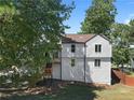 Two-story house exterior with deck and landscaping at 5111 Manitou Way, Stone Mountain, GA 30087