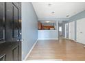 Light and airy entryway with view of kitchen and other rooms at 1467 Riverrock Trl, Riverdale, GA 30296