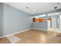 Light-filled living room with laminate flooring and open concept design at 1467 Riverrock Trl, Riverdale, GA 30296