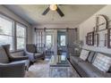 Spacious living area with gray sofas, barn doors, and a view into the dining area at 3723 Debelle St, Clarkston, GA 30021