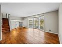 Open living room with hardwood floors and a large bay window at 2592 Evergreen Trl, Smyrna, GA 30082