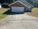 Long driveway leading to a one-car garage at 5606 Rockingwood Ct, Atlanta, GA 30349