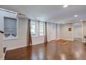 Finished basement with hardwood floors and an exterior entrance at 174 Rivertown Rd, Fairburn, GA 30213