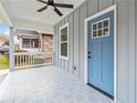 Charming front porch with blue door and patterned tile flooring at 1016 Michigan Nw Ave, Atlanta, GA 30314