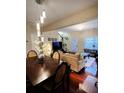 Open dining room with hardwood floors and a stylish chandelier at 2555 Flat Shoals Rd Apt # 3305, College Park, GA 30349
