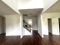 Two story foyer with hardwood floors and an elegant staircase at 2469 Osceola Rd, Lithonia, GA 30058