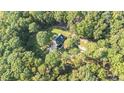 House nestled in a wooded area, offering privacy at 511 Rc Thompson Rd, Dallas, GA 30157