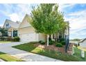 House exterior showcasing a two-car garage and well-maintained landscaping at 418 Laurel Spring Ct, Canton, GA 30114