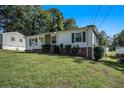 Charming ranch home with a brick facade and green door at 3650 Croft Nw Pl, Atlanta, GA 30331
