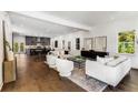 Open concept living room with hardwood floors and modern furniture at 971 Washington Sw Pl, Atlanta, GA 30314