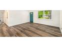 Spacious living area with wood-look flooring and an open concept at 408 Belgarde Place Se, Atlanta, GA 30354