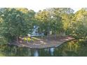 Lakefront property with expansive backyard and dock at 7149 Burnside Ct, Villa Rica, GA 30180